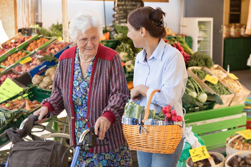 Senior-woman-with-caregiver-shopping